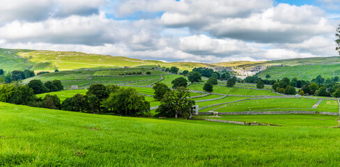 A panorama view across the dales towards Malham Cove, Yorkshire in summertime