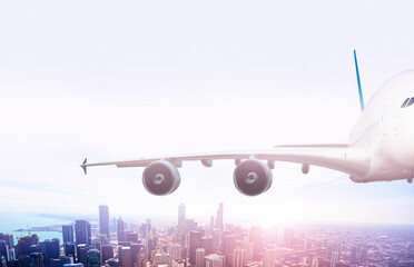 Wing of big jet airplane fly over Chicago downtown