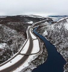 Road through the snow covered valley