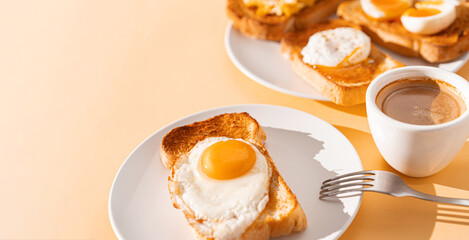 fried Toast bread with four different types of cooked chicken eggs, scrambled eggs, fried eggs, poached egg and creamed egg. Breakfast of chicken eggs. methods of making eggs for breakfast