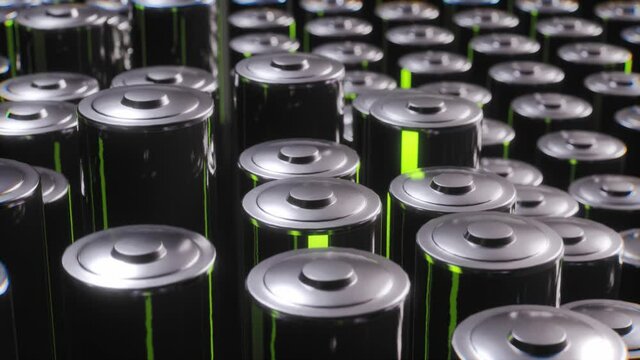 Carbon Batteries On Factory. Battery Full Of Power Glowing Green. Loop Animation