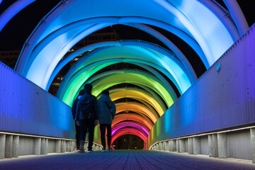 People walking through illuminated colorful tunnel at night in Odaiba, Tokyo　東京・お台場...