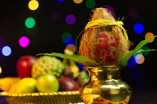 Brass Pot Kalash Decorated With Coconut, Mango Leaf and plate of fruits. Used In Navratri Pooja, Dussehra Puja, Karva Chauth, Teej, Ganesh Chaturthi Or Shubh Deepavali, grih or grah pravesh