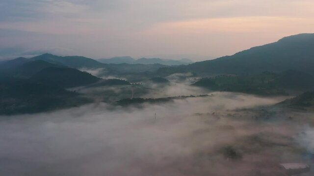 4K drone footage of misty landscape view on the famous sunrise viewpoint in Phu Sa nao hill in Muang Chet Ton, Uttaradit province, Thailand.