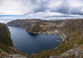 Fototapeta na wymiar Coastal town snuggled into the fjord