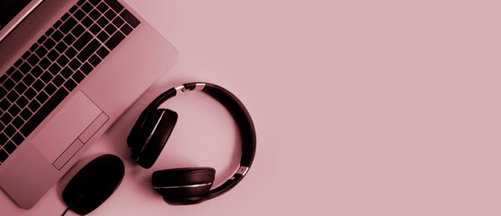 laptop, headphones on a colored background
