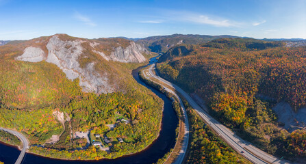 Fototapeta premium Highway running through the autumn valley