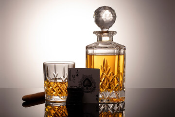 Cognac or brandy glass isolated on gray white background with clipping path. Decander with cognac...
