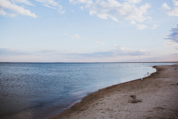 Fototapeta na wymiar The sea at dusk. Blue calm sea. Deserted beach