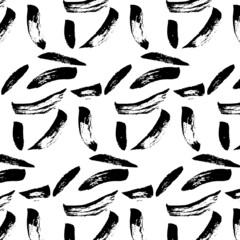 Seamless vector background from strokes of a brush of different shapes. Black on a white background. Brush drawing, grunge, doodle. Image for fabric, wrapping paper, wallpaper. Minimalism.