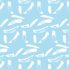 Seamless vector background of brush strokes of different shapes and sizes. White ones on a blue background. Brush drawing, grunge, doodle. Image for fabric, wrapping paper, wallpaper. Minimalism.