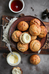 Lemon muffins with poppy seeds on a plate. Creamy half cupcake