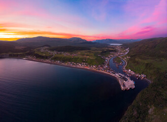 Panoramic sunrise over a rural coastal town