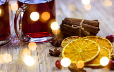 glasses with mulled wine on a wooden background. new year concept