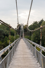 Fototapeta na wymiar Suspended pedestrian bridge over the Neman