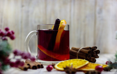 glasses with mulled wine on a wooden background. new year concept