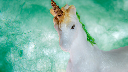 Isolated unicorn on a green background