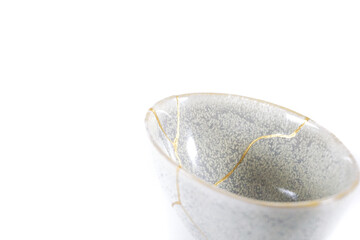 Antique Japanese Kintsugi, grey Kintsugi bowl restored with gold cracks. Wabisabi pottery
