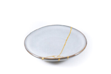 Antique Japanese Kintsugi, light grey Kintsugi plate restored with gold cracks. Wabisabi pottery