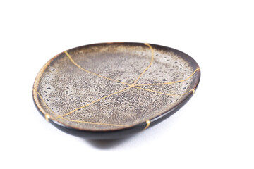 Antique Japanese Kintsugi, brown Kintsugi plate restored with gold cracks. Wabisabi pottery