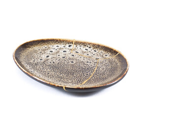 Antique Japanese Kintsugi, brown Kintsugi plate restored with gold cracks. Wabisabi pottery
