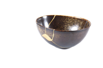 Antique Japanese Kintsugi, brown black Kintsugi bowl restored with gold cracks.
