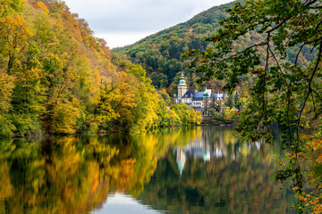 Fototapeta na wymiar Hungarian trail tour autumn season at Hamori lake in Miskolc Lillafured with the palace castle and reflection