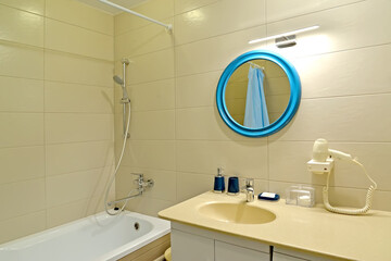 Bathroom with round mirror