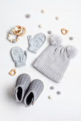 Collection of cute organic  baby clothes and booties. Warm hat, mittens and boots for cold weather...