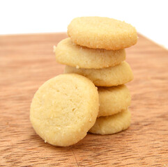 Freshly baked sugar cookies on wooden board