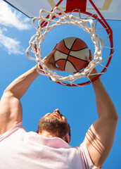 guy has sport motivation. sport and hobby. dunk in basket. slam dunk in motion.