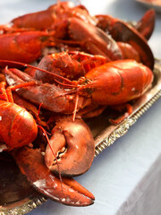 Red cooked lobsters on a silver platter