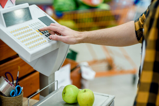 Close shot of a electrical fruit scales in the supermarket