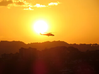 Mil Mi-35M2 35 in the sunset over the city