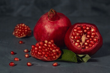 Ripe pomegranate fruit on gray background
