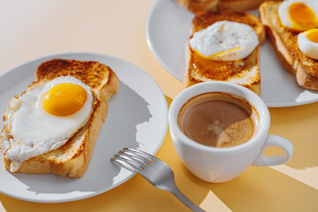 fried Toast bread with four different types of cooked chicken eggs, scrambled eggs, fried eggs, poached egg and creamed egg. Breakfast of chicken eggs.