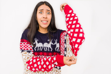 christmas gift become a bad santa idea on a unhappy woman, ugly sweater for christmas celebration