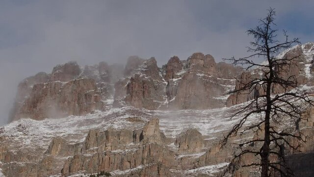 Cliffs from Hayden Peak in the Uinta Mountains steaming as the snow melts after snow storm early in the Fall.
