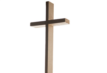 Christian wooden cross backlit on white background