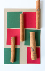 cinnamon sticks arranged on paper