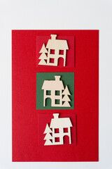 wooden christmas village house shapes or silhouettes arranged on paper