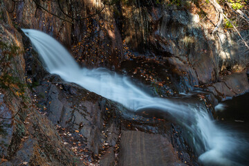 A long exposure of a flowing waterfall in Maine. - 463936710