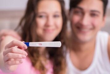 Happy couple finding out about pregnancy test results