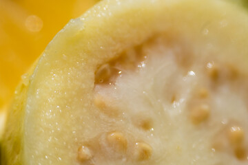 Fototapeta na wymiar Texture of a rich and juicy guava or guayaba 