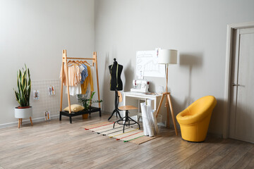 Tailor's workplace with mannequin in modern atelier