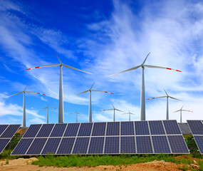 Solar photovoltaic panels and wind turbines. Energy concept，The blue sky white clouds in the background