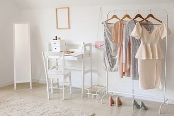 Interior of stylish room with clothes