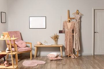 Interior of stylish room with clothes