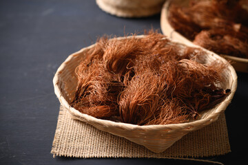 Dry Bombax ceiba flower stamen in a bamboo basket, Food ingredients in Northern Thai food