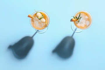 Glasses of delicious melon cocktail on blue background